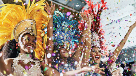 dancers blowing glitter at Brazil carnival, thumbnail size
