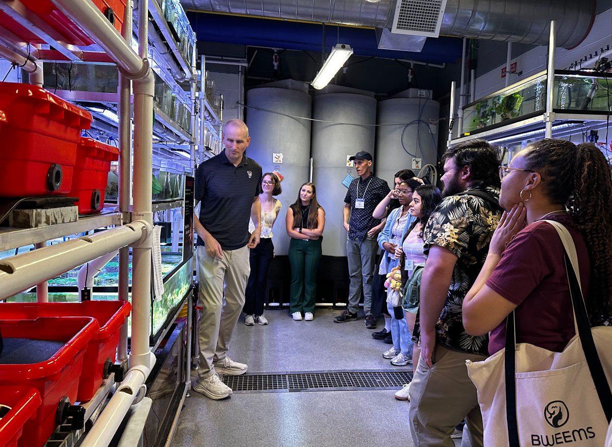 Chris Eads guides participants through the Yates Mill Aquatic Conservation Center laboratory