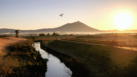 Mount Tsukuba at sunrise with stream in front