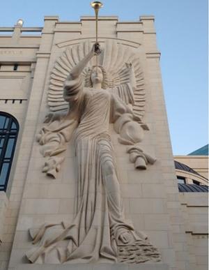 Stone carving of an angel blowing a trumpet on Bass Performance Hall exterior