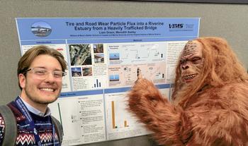 Sasquatch asking questions at a student's poster during SETAC Portland