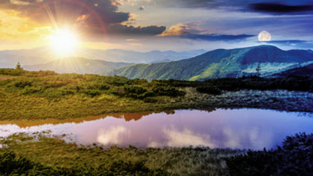 Sun and moon close over the horizon, signifying equinox or night and day