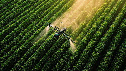 drone spraying biopesticides on crops