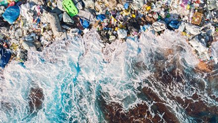 ocean cliff with plastic on shore