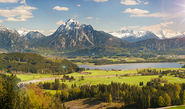 landscape with snow-capped mountains and blue lake