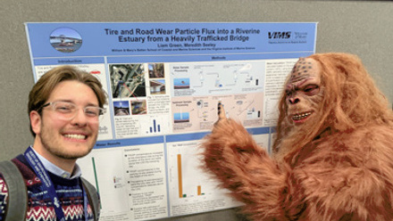 Sasquatch asking student questions about his poster at SETAC Portland