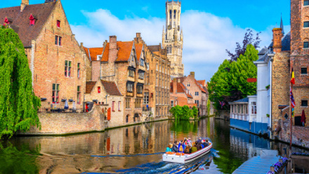 Historic Canal in Bruges featuring the Belfry Tower