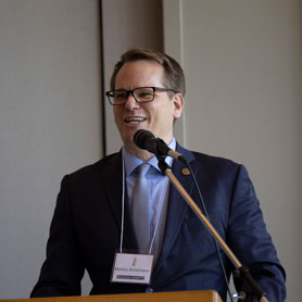 professional speaking at a podium