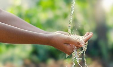 clean water running through hands